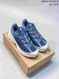 Pair of blue and white Salomon sneakers displayed on a box