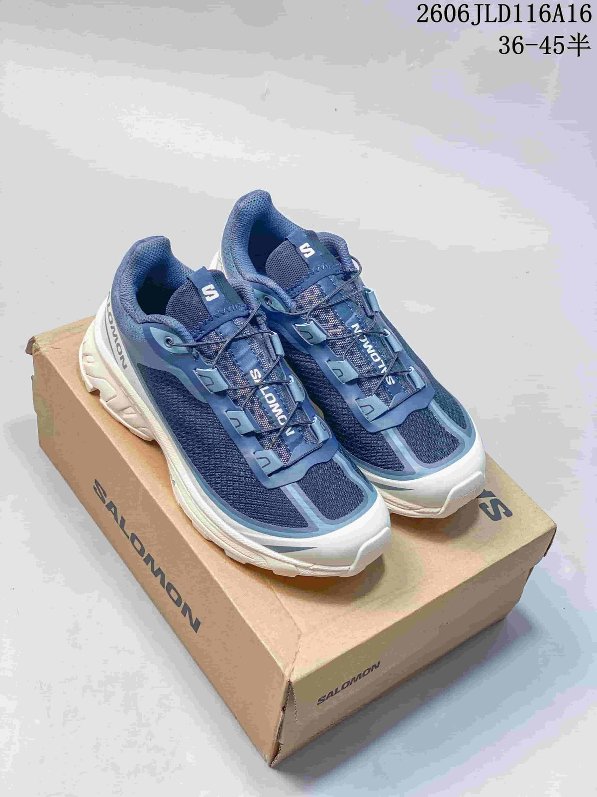 Pair of blue and white Salomon sneakers displayed on a box