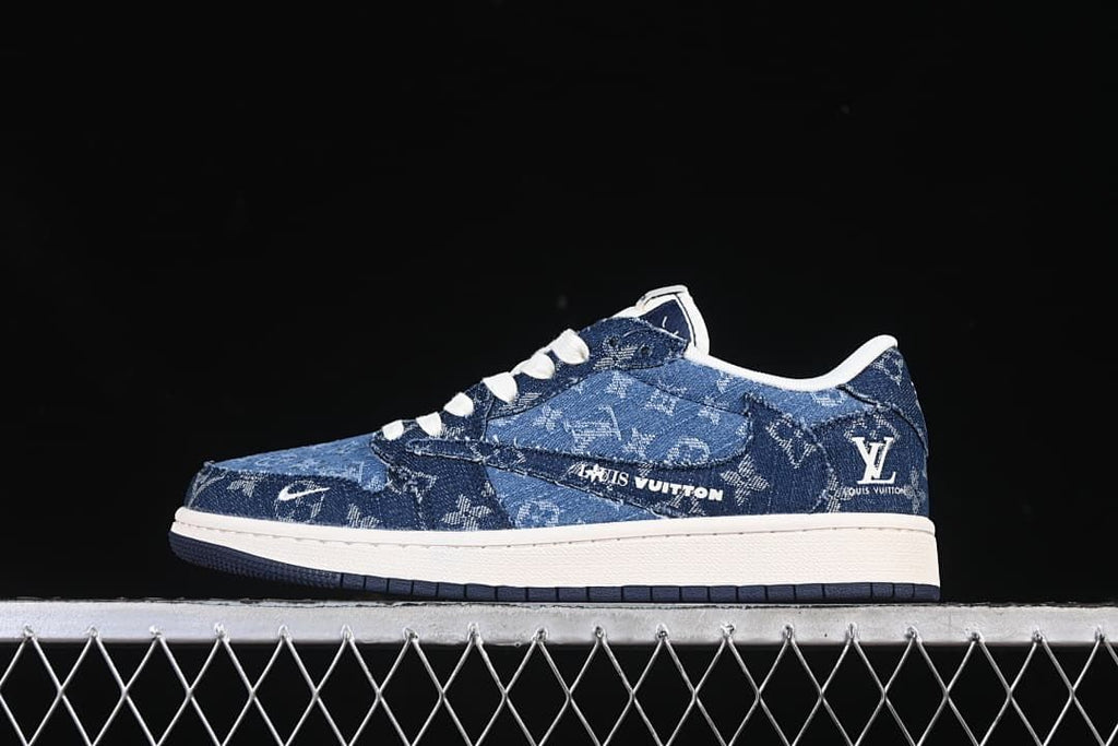 Side view of a dark blue patterned low-top sneaker with white graphics, white midsole, and dark outsole.