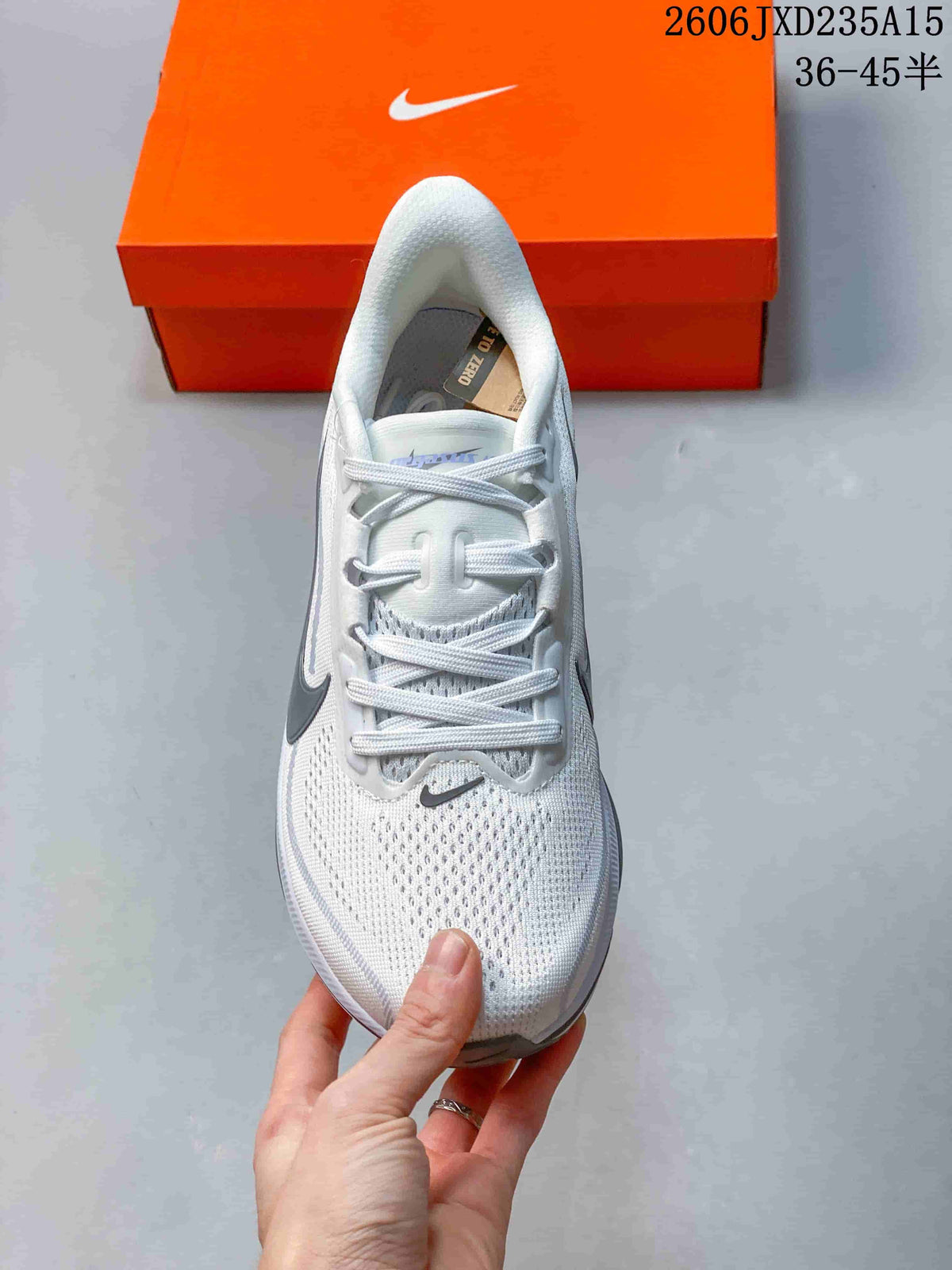 Top view of the white Nike Pegasus 42 running shoe with laces and mesh-patterned upper