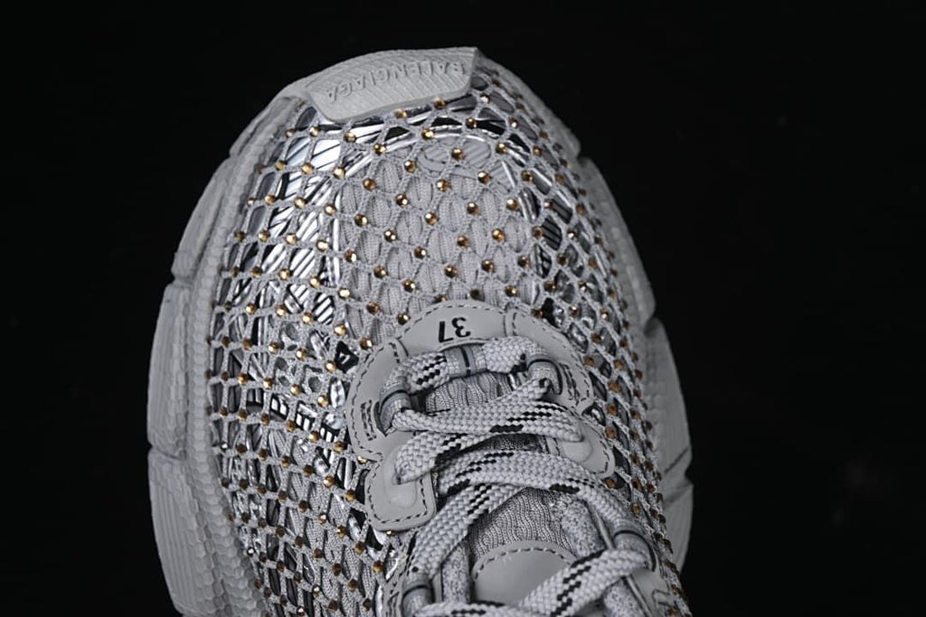 Top view of the sneaker showing its openwork upper and laces.