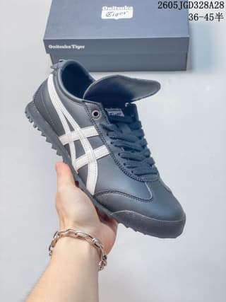 Side view of a navy Onitsuka Tiger MEXICO 66 GOLF sneaker with white stripes and laces