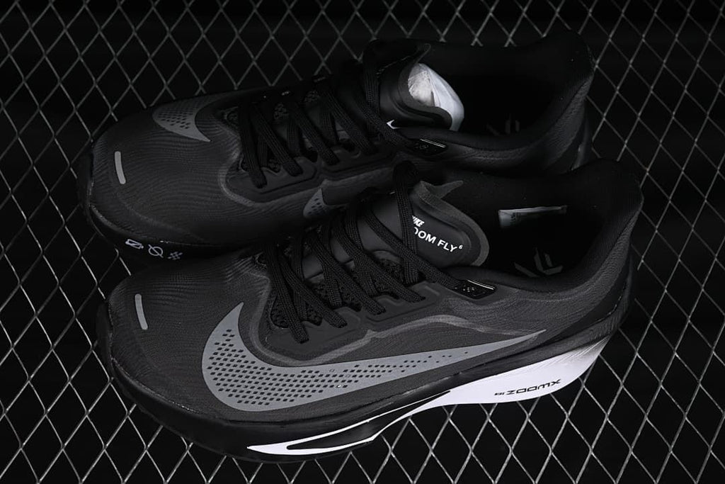Pair of black and gray Nike Zoom Fly 6 running shoes shown from above