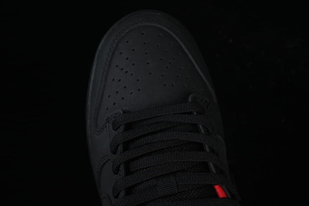 Top view of the perforated black toe and black laces