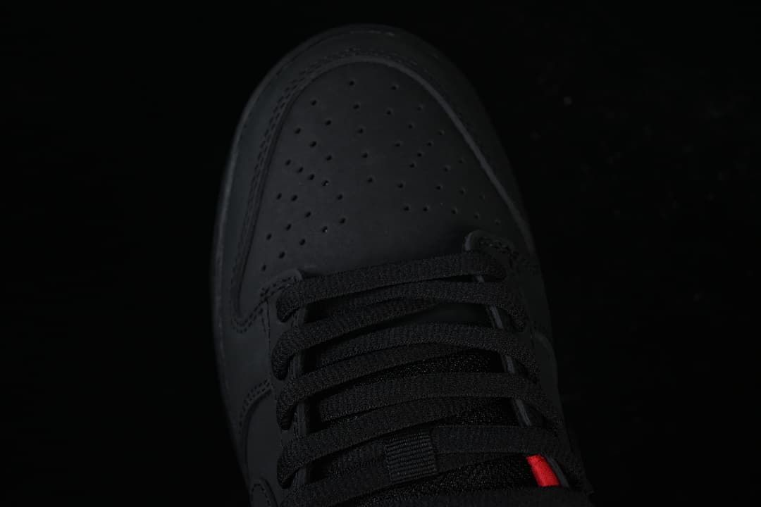 Top view of the perforated black toe and black laces