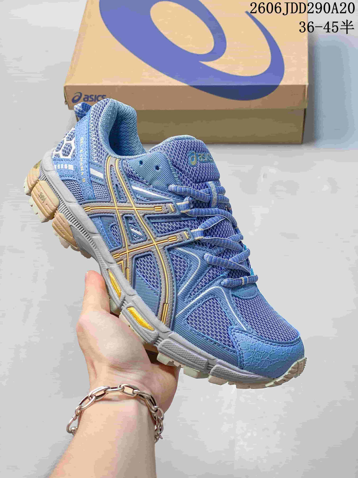 ASICS Gel-Kahana 8 sneaker in blue with yellow and grey details.