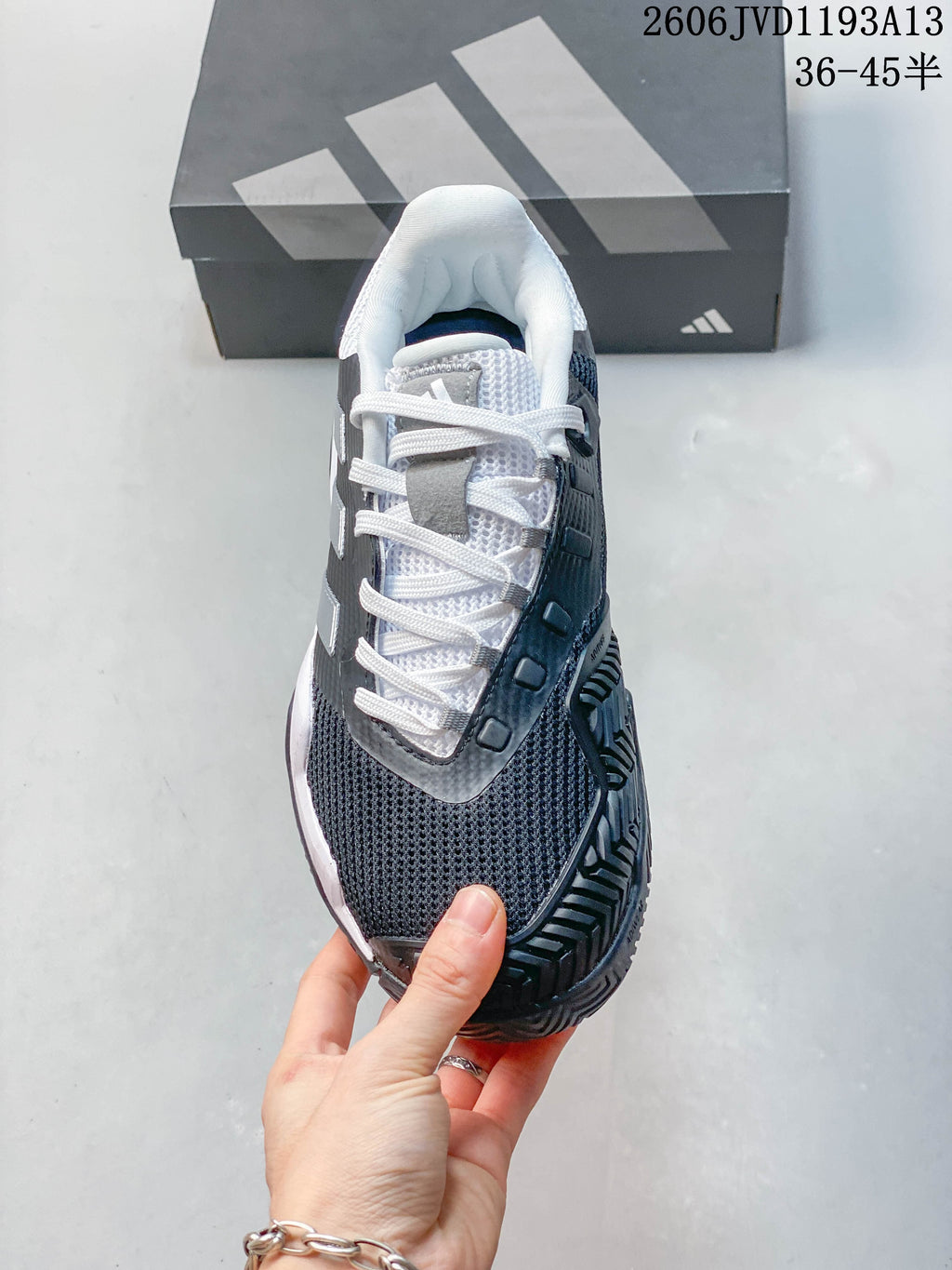 Top view of an Adidas Barricade 13 tennis shoe with white laces