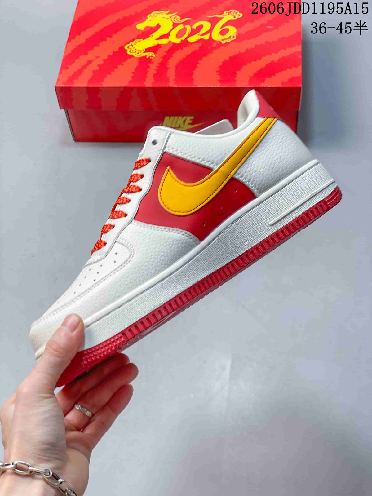 Side view of the white and red Nike Air Force 1 Low with yellow Swoosh detailing