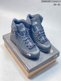 Pair of dark gray The North Face Verto Alpine high-top hiking boots displayed on a box.