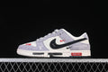 Side view of white and pale lavender low-top sneakers with a black Swoosh and red and branded details.