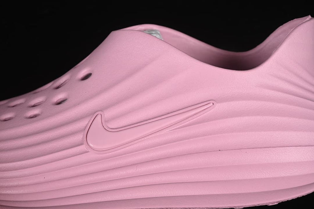 Close-up of the perforated upper, side logo and sculpted ridges.