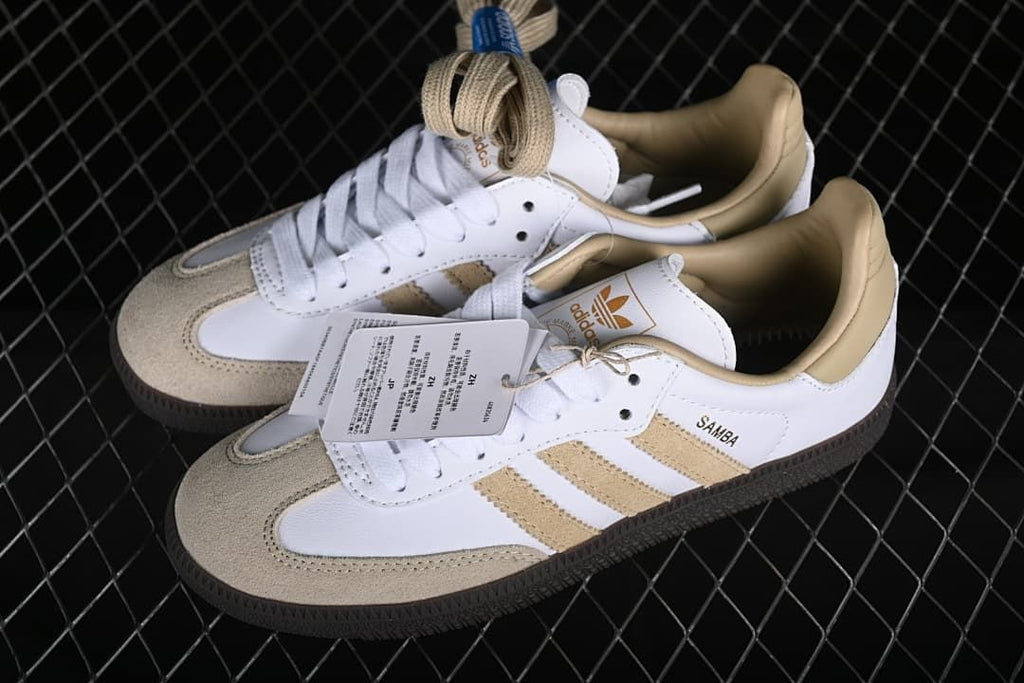 Pair of white and beige Samba OG sneakers with an extra set of beige laces