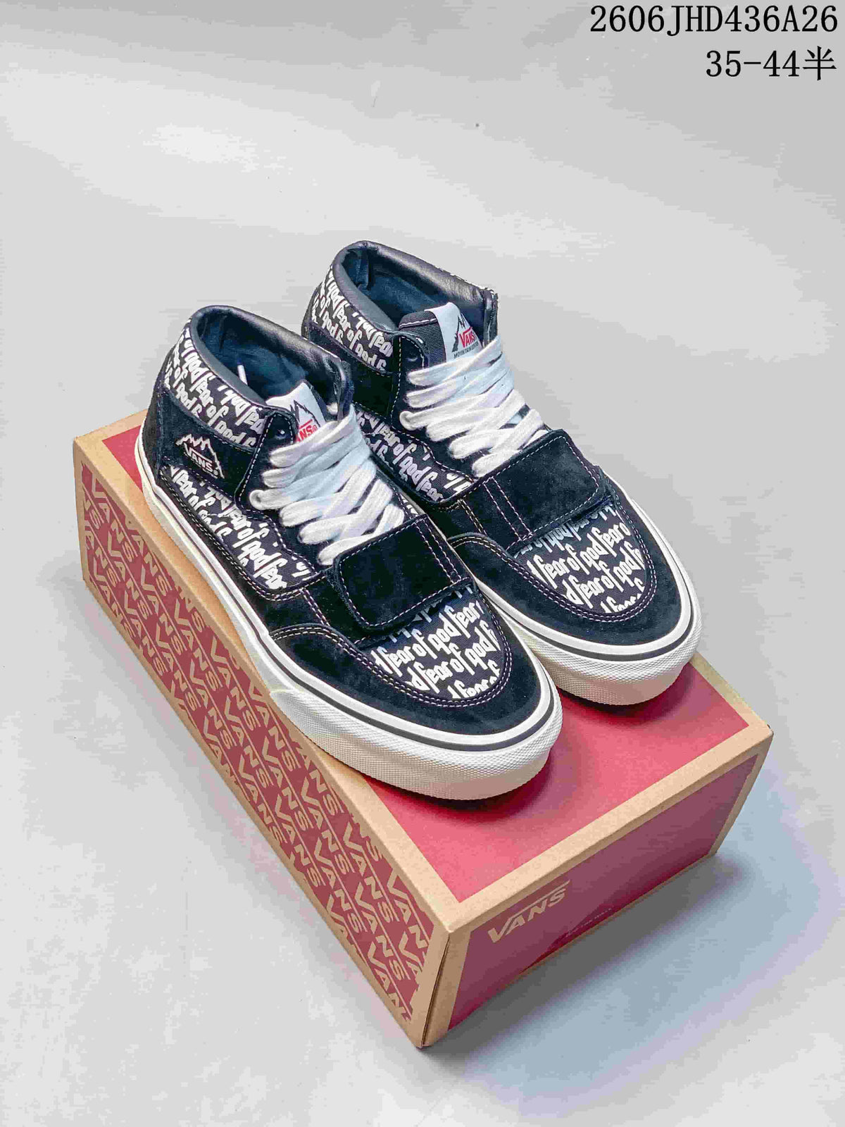 Navy Vans Era 95 Reissue-style sneakers with Fear of God name print, white laces and a forefoot strap, displayed on a Vans box.
