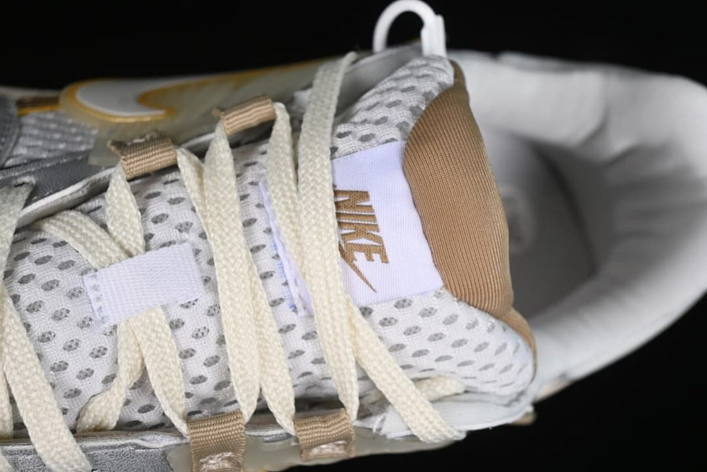Close-up of the lace area, tongue label and tan accents.