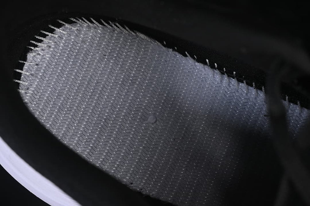 Close-up of the textured interior lining of the black shoe