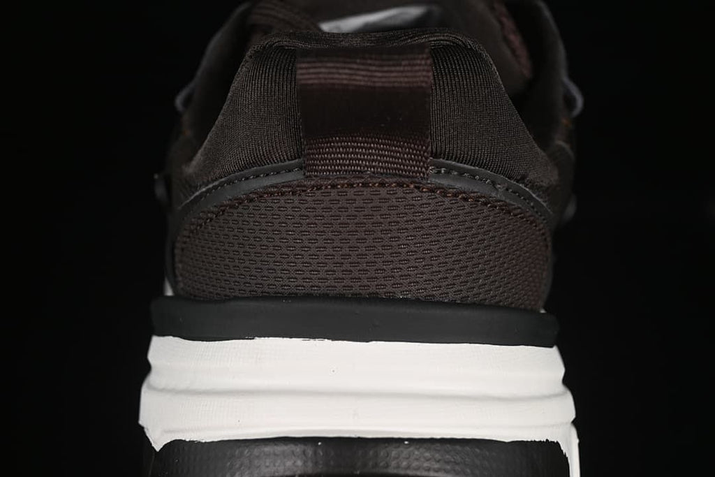 Rear view showing the mesh-look heel, pull tab, and layered sole