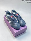 Pair of navy Onitsuka Tiger Mexico 66 Deluxe sneakers with white and gold side stripes