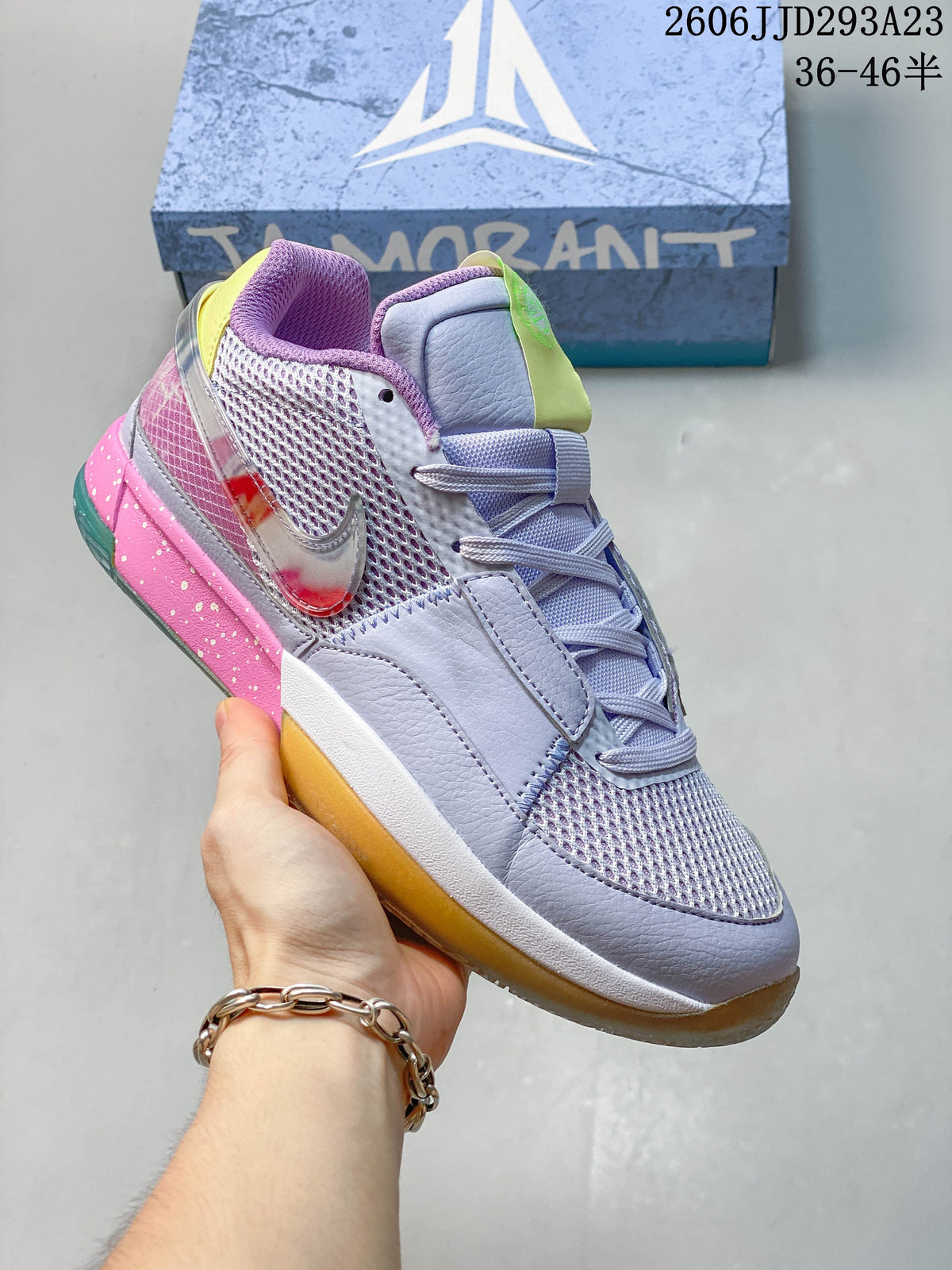 Light purple Nike Ja 1 EP shoe with pink, yellow and green details.