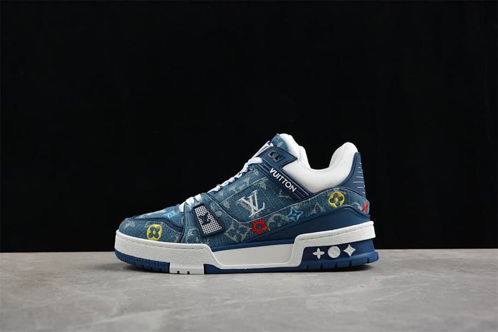 Blue patterned low-top sneakers with white laces and a chunky white-and-blue sole, shown from the side.