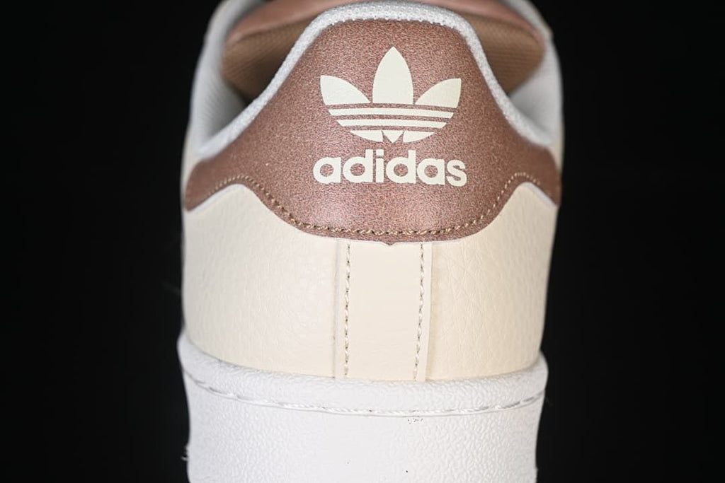 Rear heel detail with brown adidas-branded panel.