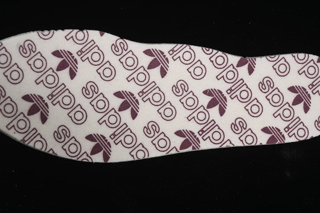 Close-up of the patterned insole with adidas logos