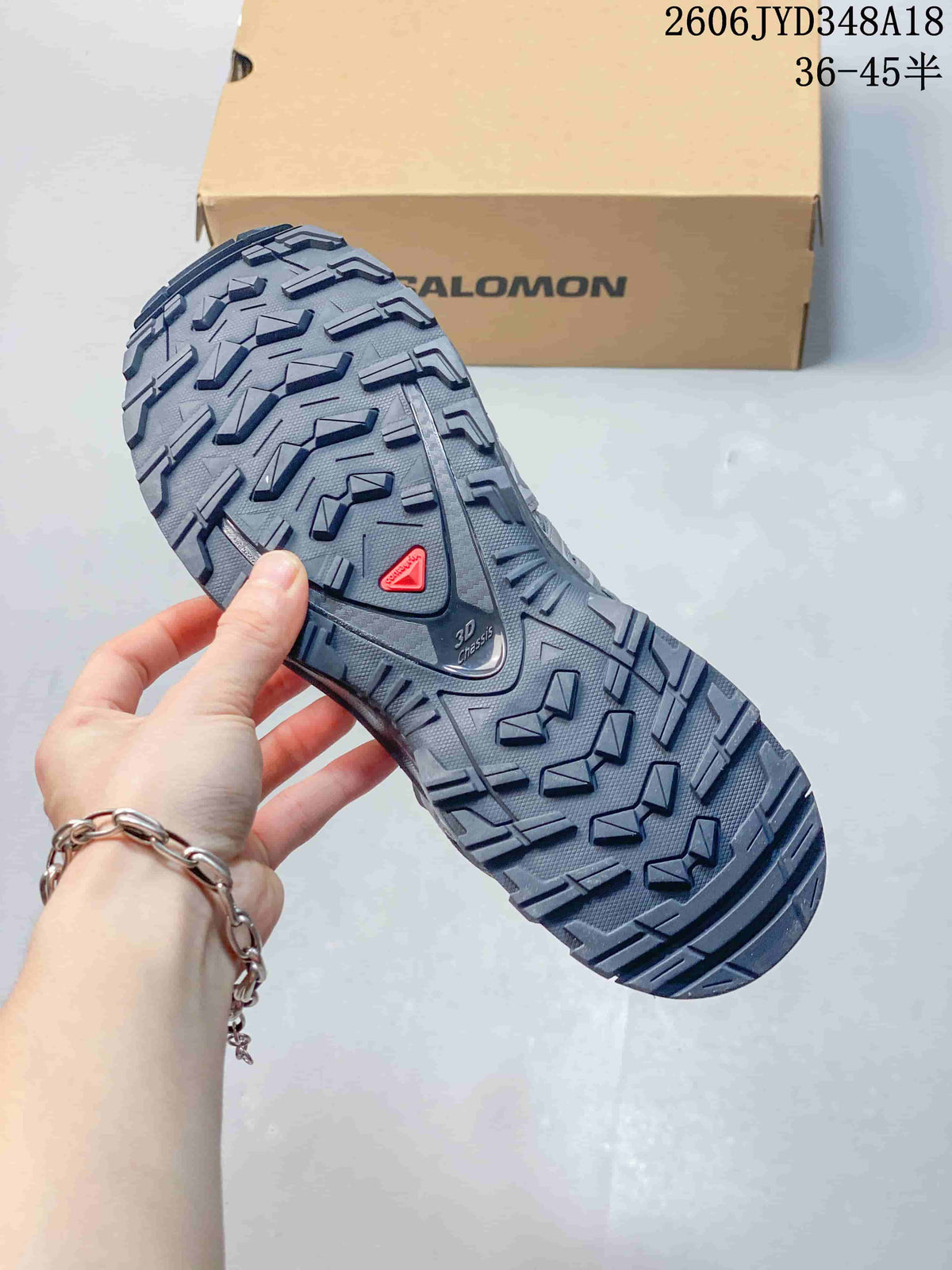 Close-up of the shoe's lugged outsole