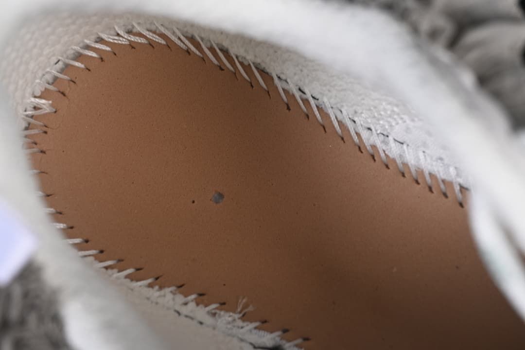 Close-up of the shoe interior and stitched insole edge
