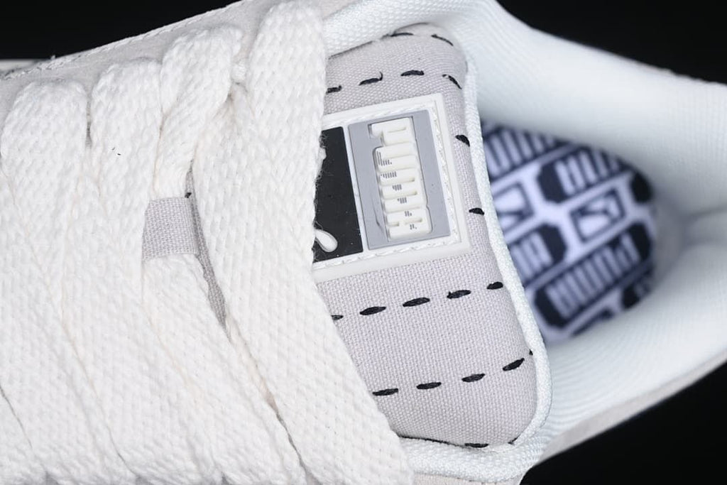 Close-up of the tongue label and patterned insole.