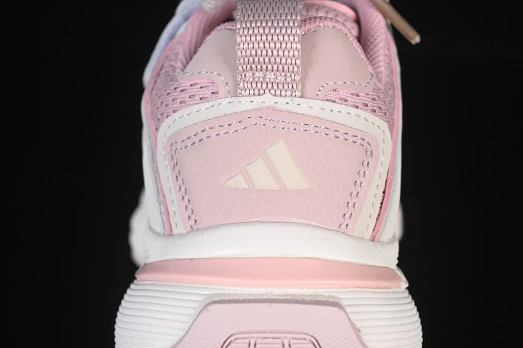 Rear view showing the pink heel panel and thick outsole