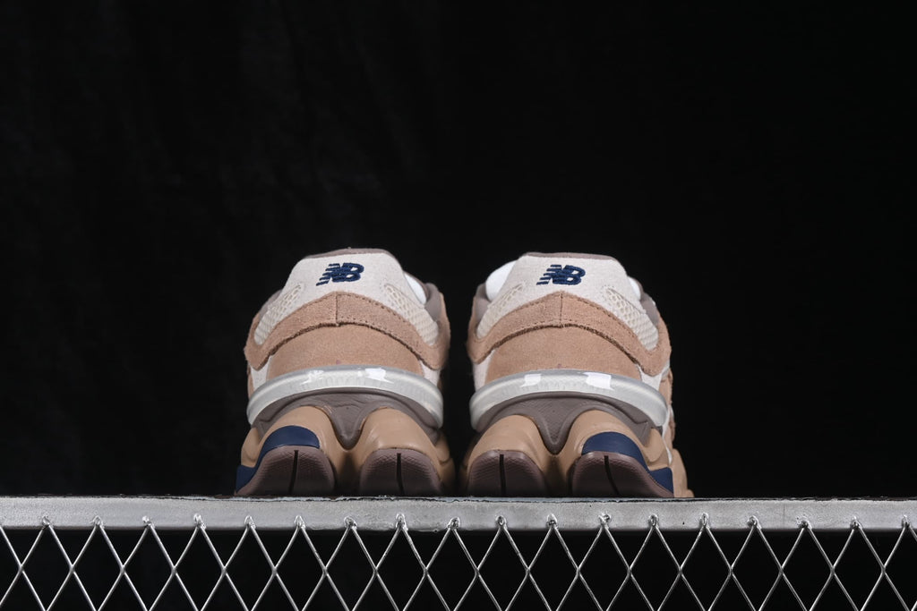 Rear view of the paired sneakers showing New Balance heel logos and the sculpted heel structure.