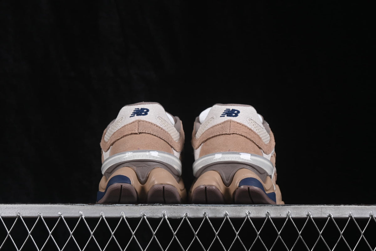 Rear view of the paired sneakers showing New Balance heel logos and the sculpted heel structure.