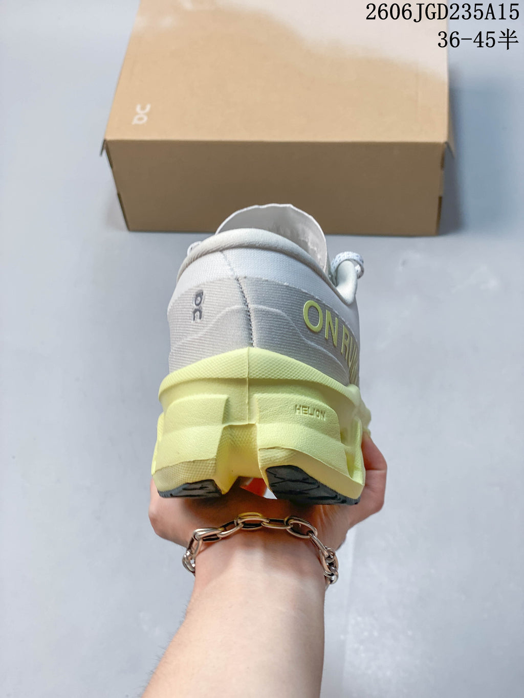 Rear view of the shoe with gray heel detailing and a pale yellow sole