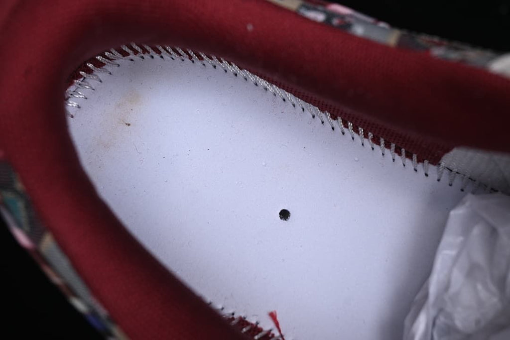 Close-up of the burgundy-lined interior of the sneaker