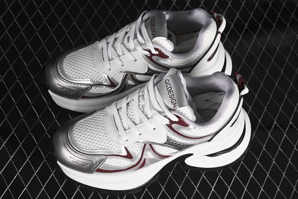 Pair of white, silver, and burgundy chunky sneakers