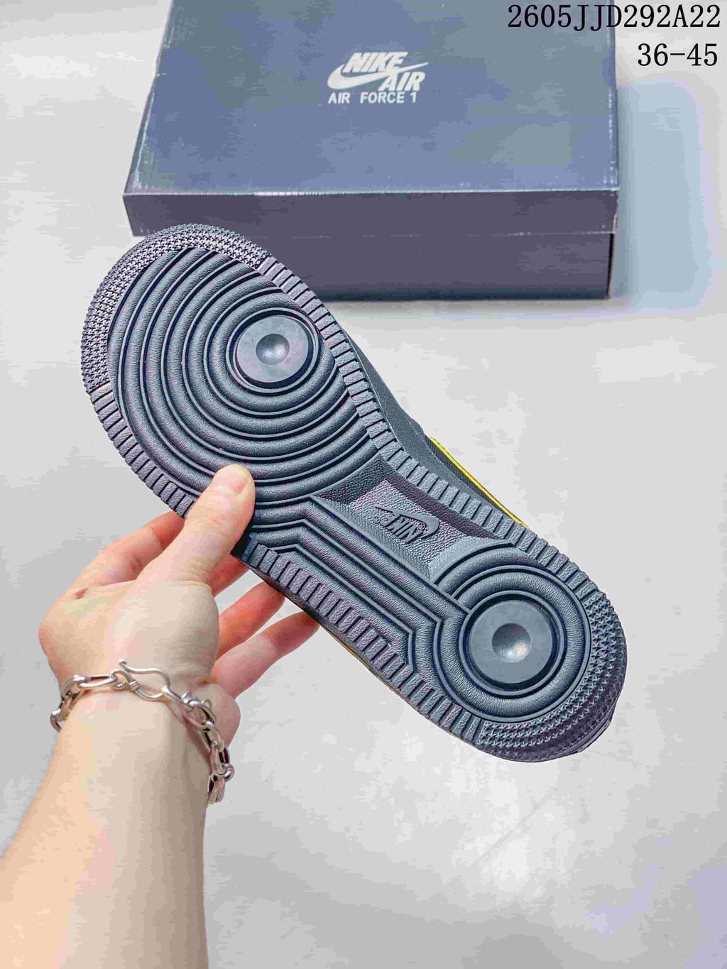 Close-up of the sneaker outsole with circular traction details