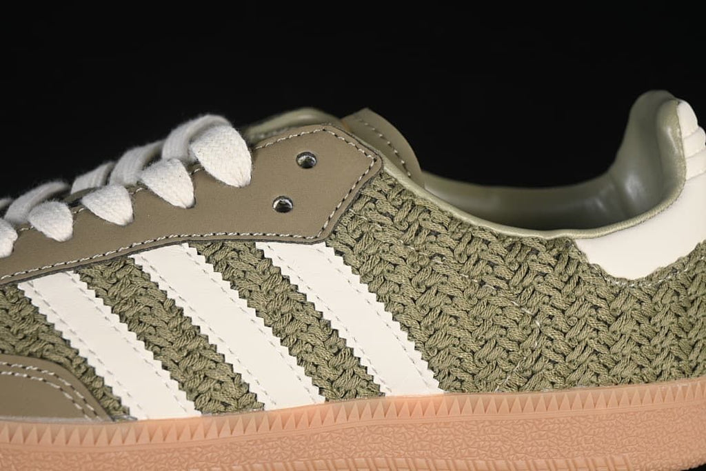 Close-up of the woven-look upper, white stripes, and cream laces