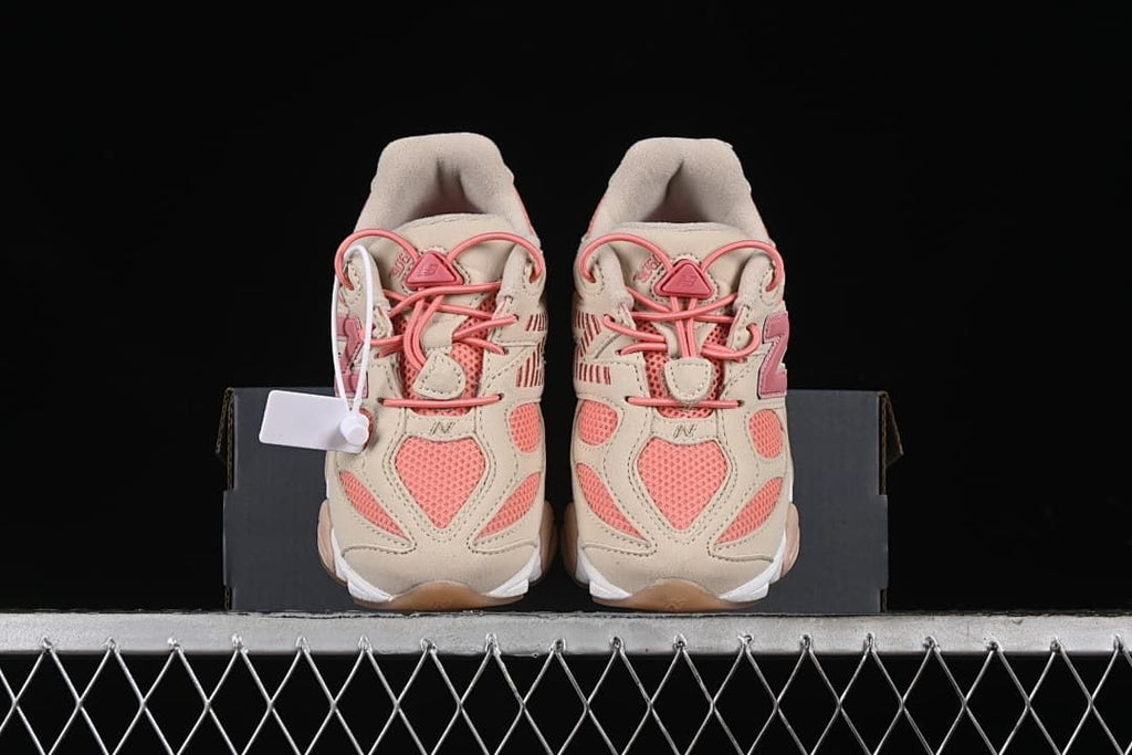 Front view of the pair of kids' sneakers