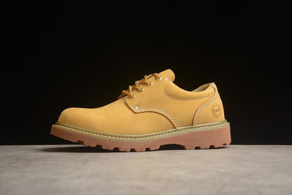 Angled side view showing stitching, heel detail, and lugged outsole