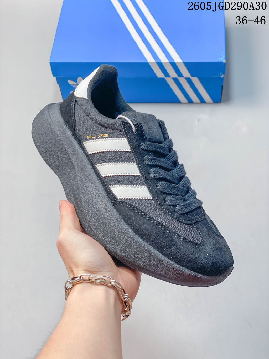 Side view of the dark adidas Originals SL 72 Pro sneaker with light-colored stripes.