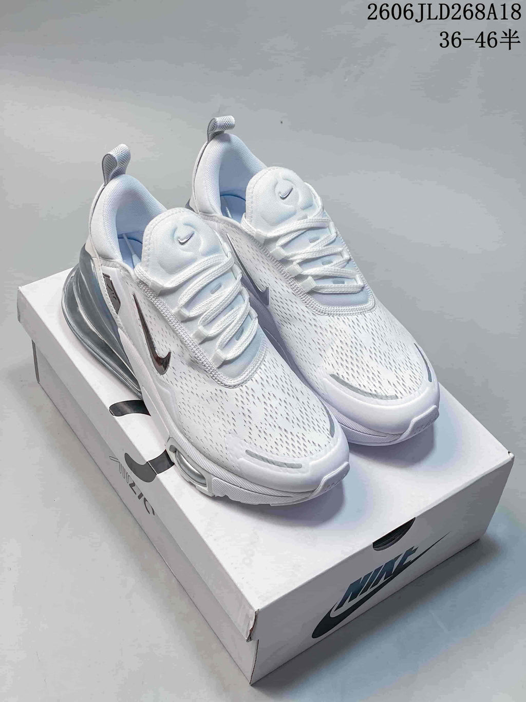 Pair of white Nike Air Max Pulse shoes shown from above on a shoebox