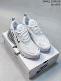 Pair of white Nike Air Max Pulse shoes shown from above on a shoebox