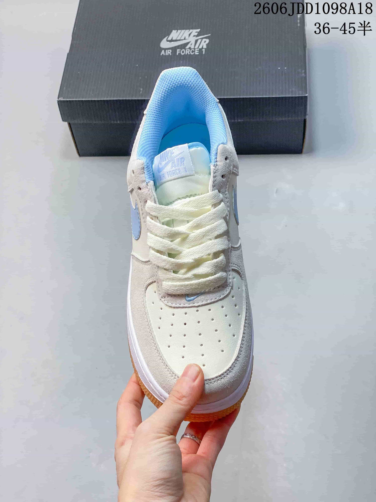 Top view showing the perforated toe, laces, and light blue lining