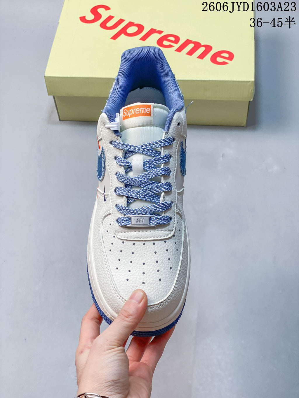 Top view showing the perforated toe, blue patterned laces, and padded collar