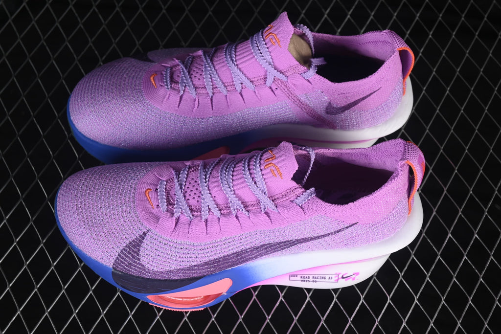 Pair of purple running shoes shown from above at an angle.