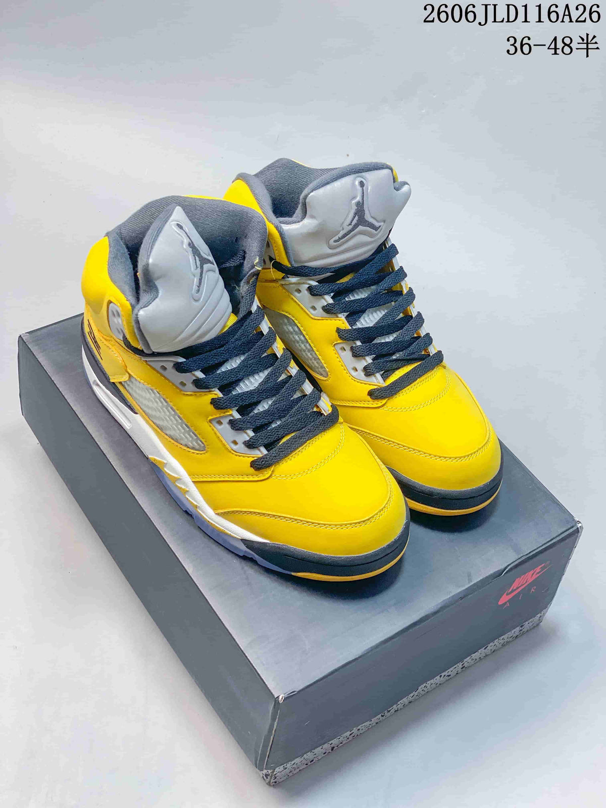 Pair of yellow high-top sneakers with gray and dark accents