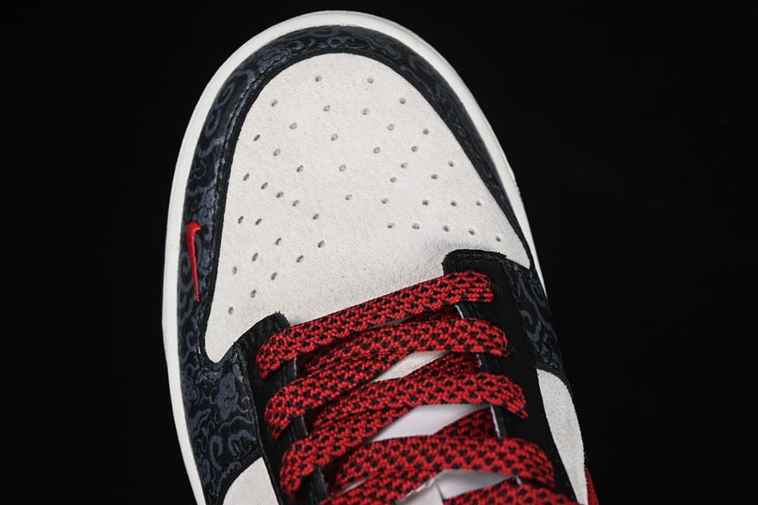 Top-down close-up of perforated toe box and patterned front overlays