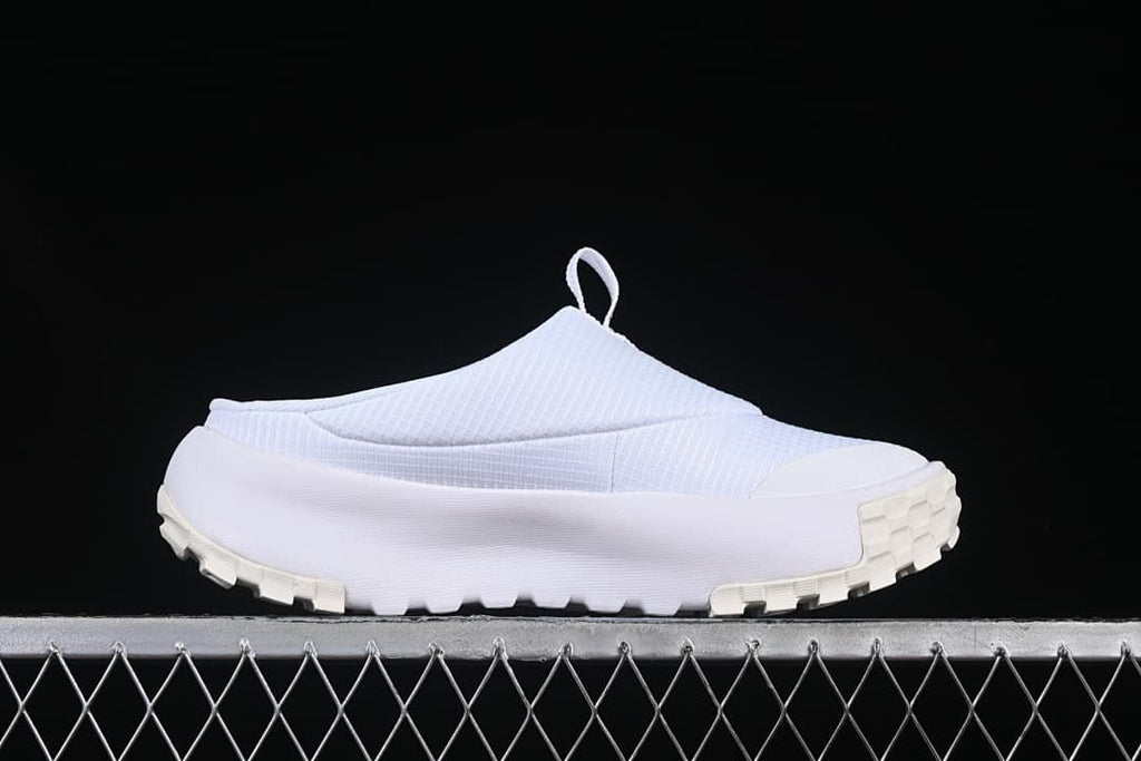 Side view highlighting the chunky lugged outsole