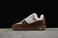 Side view of a brown and white LV Archlight-style sneaker against a dark background.