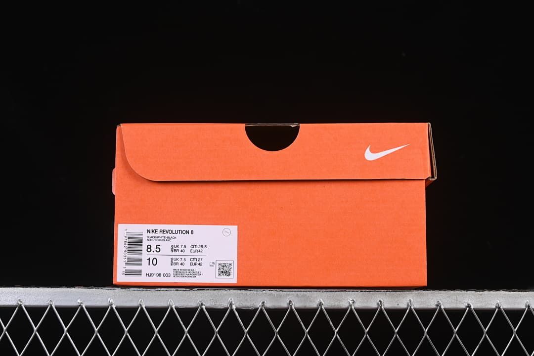 Orange shoe box with label identifying Nike Revolution 8 and style code HJ9198-003