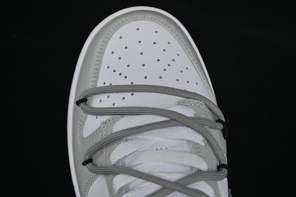 Top-down view of the perforated toe and layered lacing